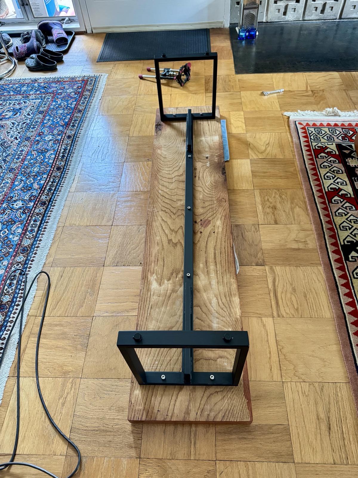 the steel base bolted to the underside of the slab, bench upside down on the floor