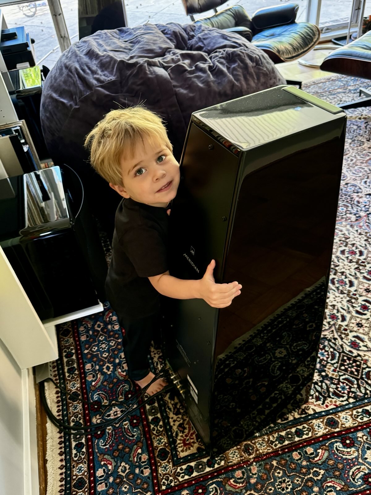 a child hugging a speaker which has been properly equalized