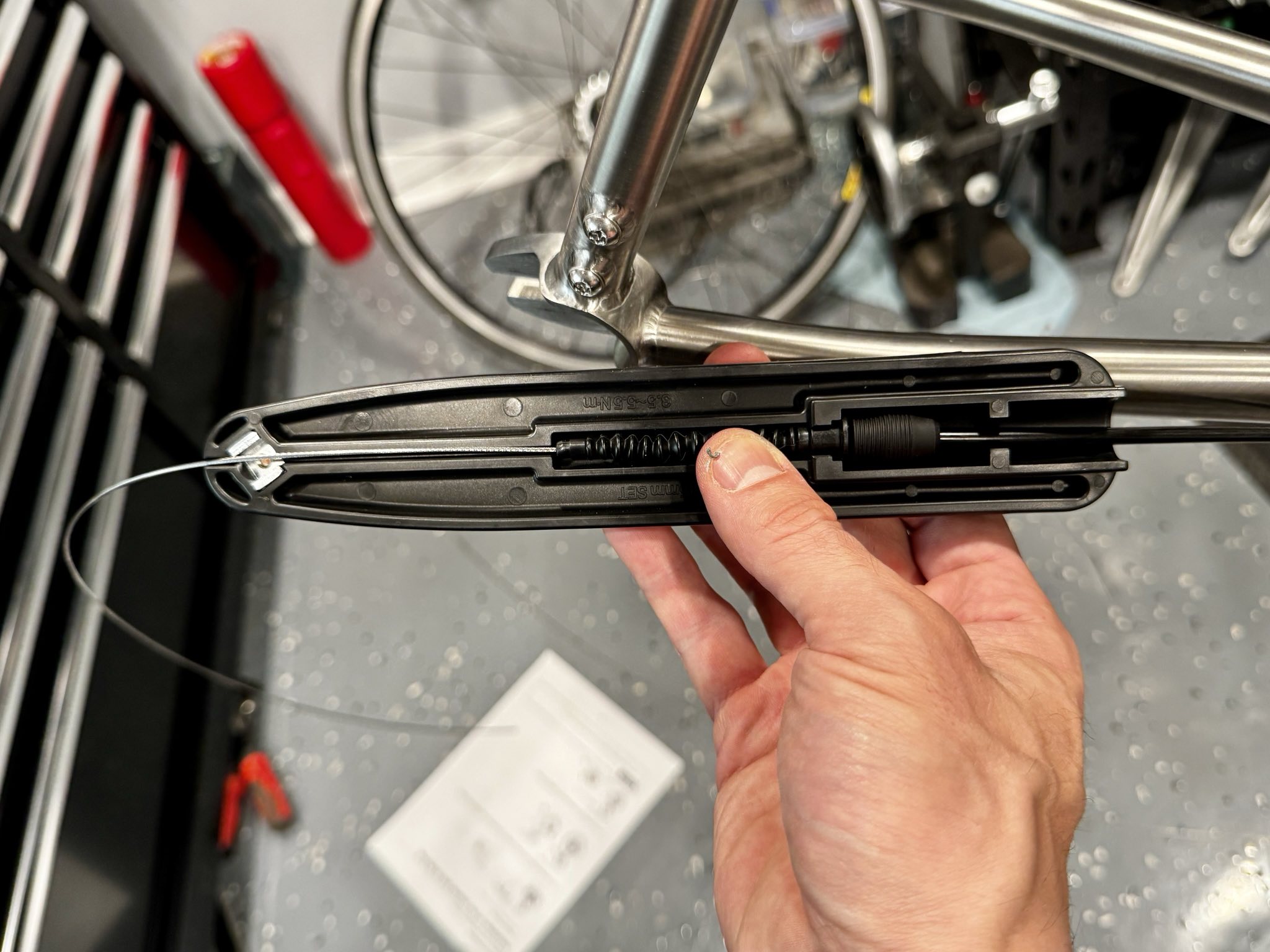 a specialized Shimano tool to set the length of the cable which is fed into the rear geared hub